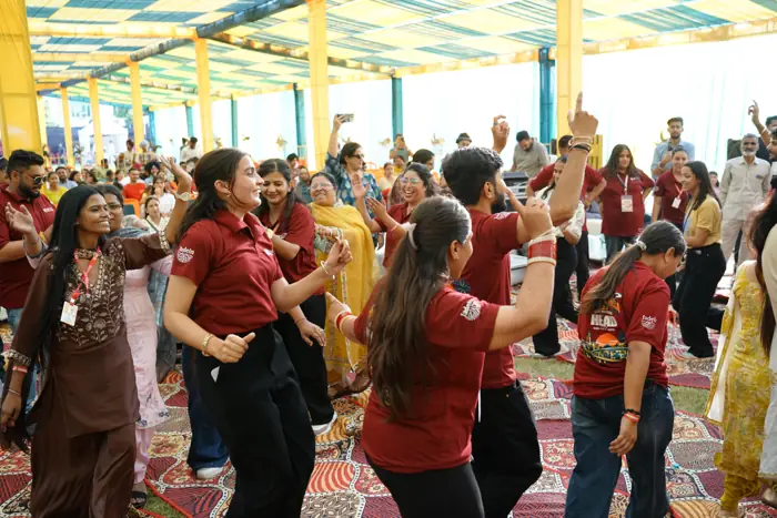 Students dancing in front of the stage