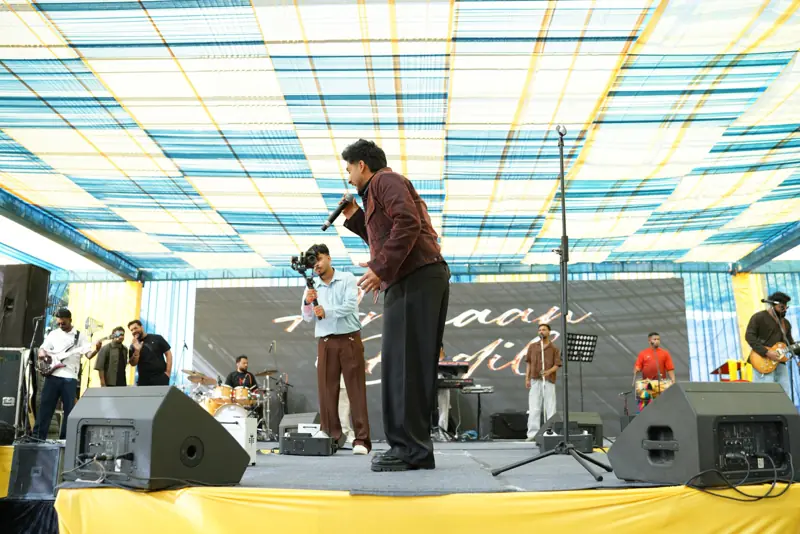 Armaan Bedil performing as the band plays